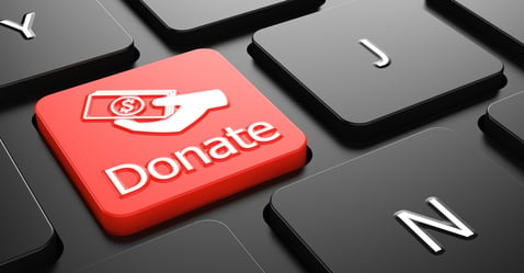 Donate with Money in the Hand Icon - Red Button on Black Computer Keyboard.-1